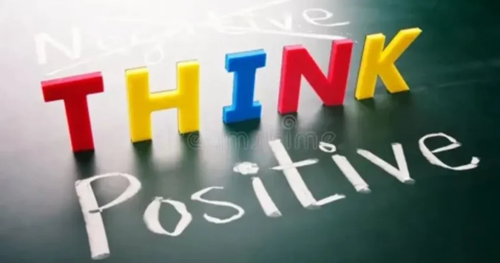 Think Positive colorful letters on chalkboard with negative crossed out