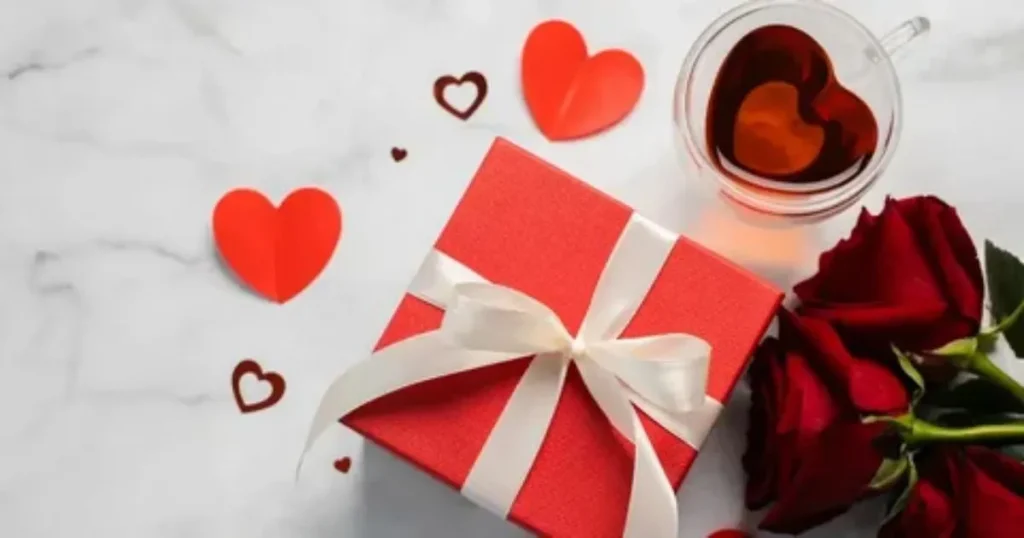 Happy Valentine's Day gift box with red roses and heart decorations