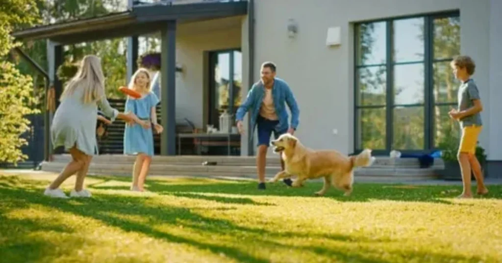 Happy family spending time together with their dog